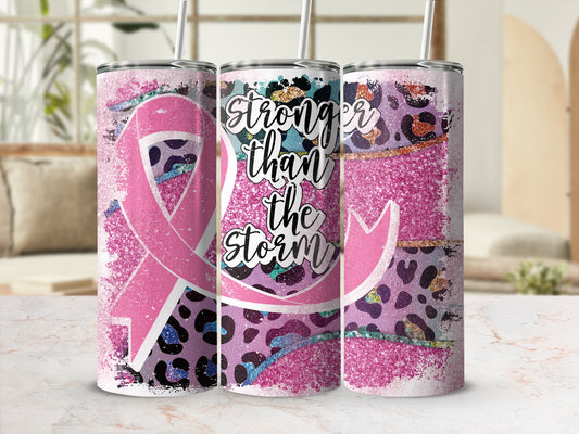 Pink ribbon tumbler with leopard print and "Stronger than the storm" text.
