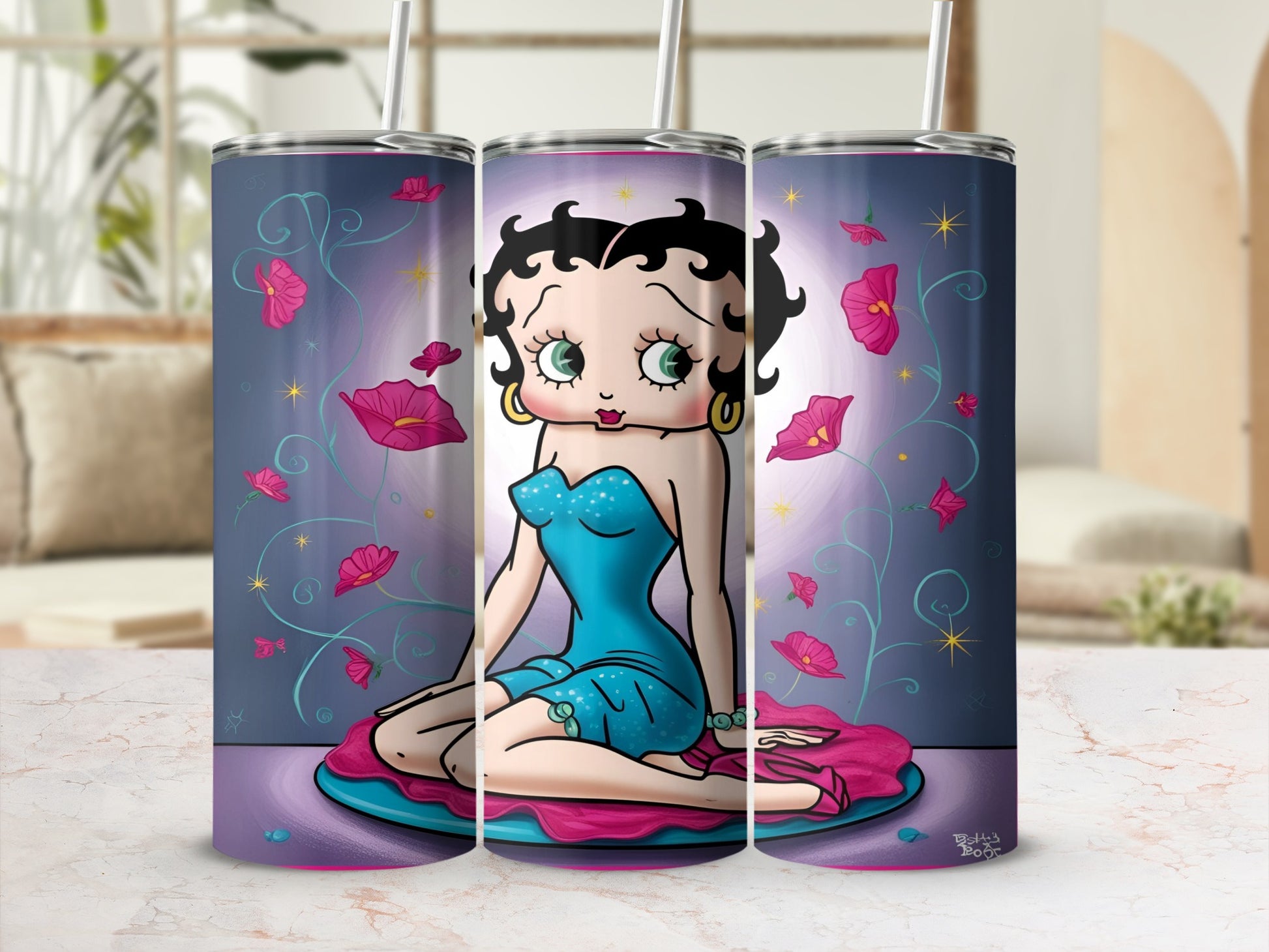 Betty Boop in a blue dress sitting on a pink cushion with pink flowers.