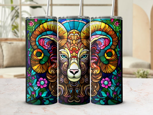 Stained glass ram with colorful floral accents on a tumbler.