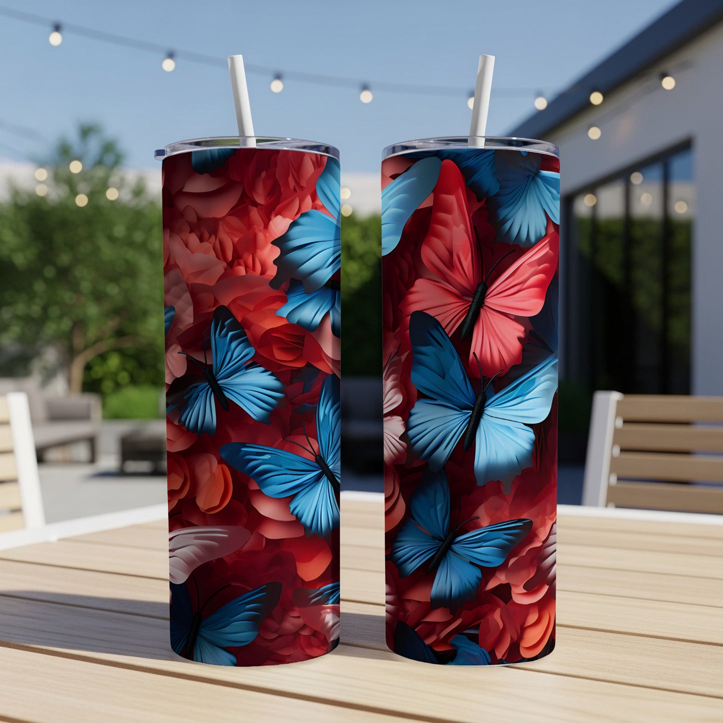 Two tall tumblers with a vibrant blue and red butterfly floral design.
