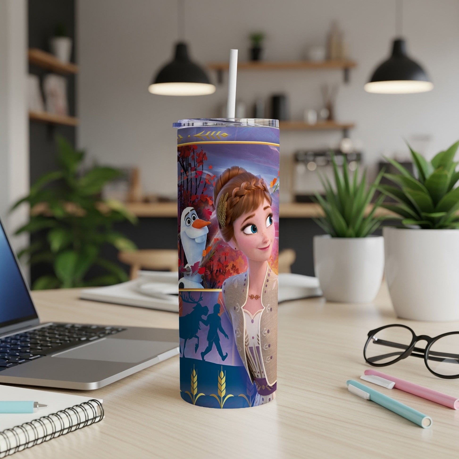 Anna from Frozen on a tumbler with a straw and a notebook.