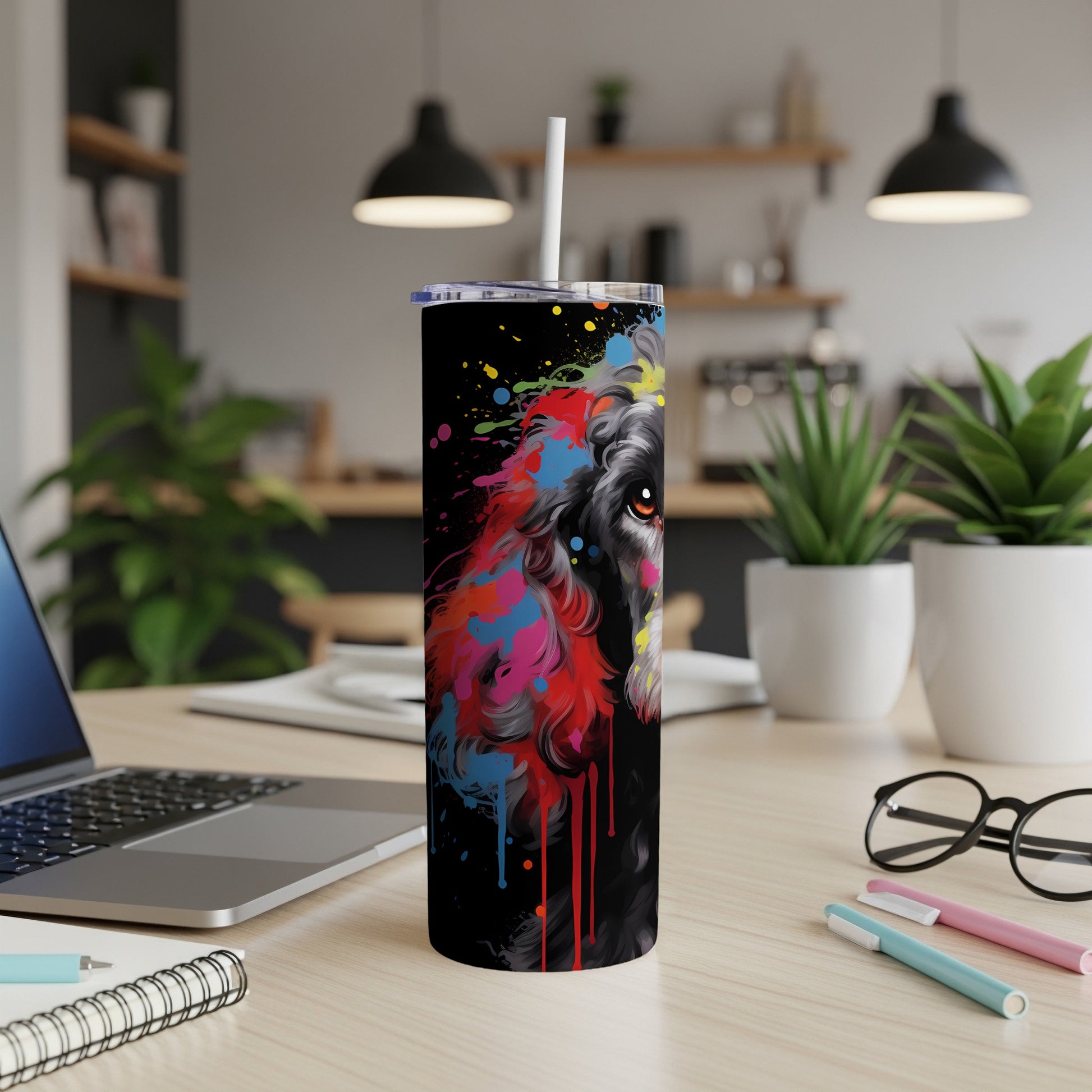 Black tumbler with a colorful splatter paint dog portrait.