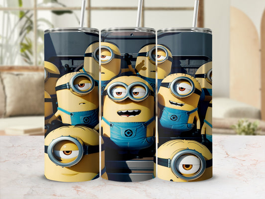 Minions in blue overalls with goggles on a cylindrical object.