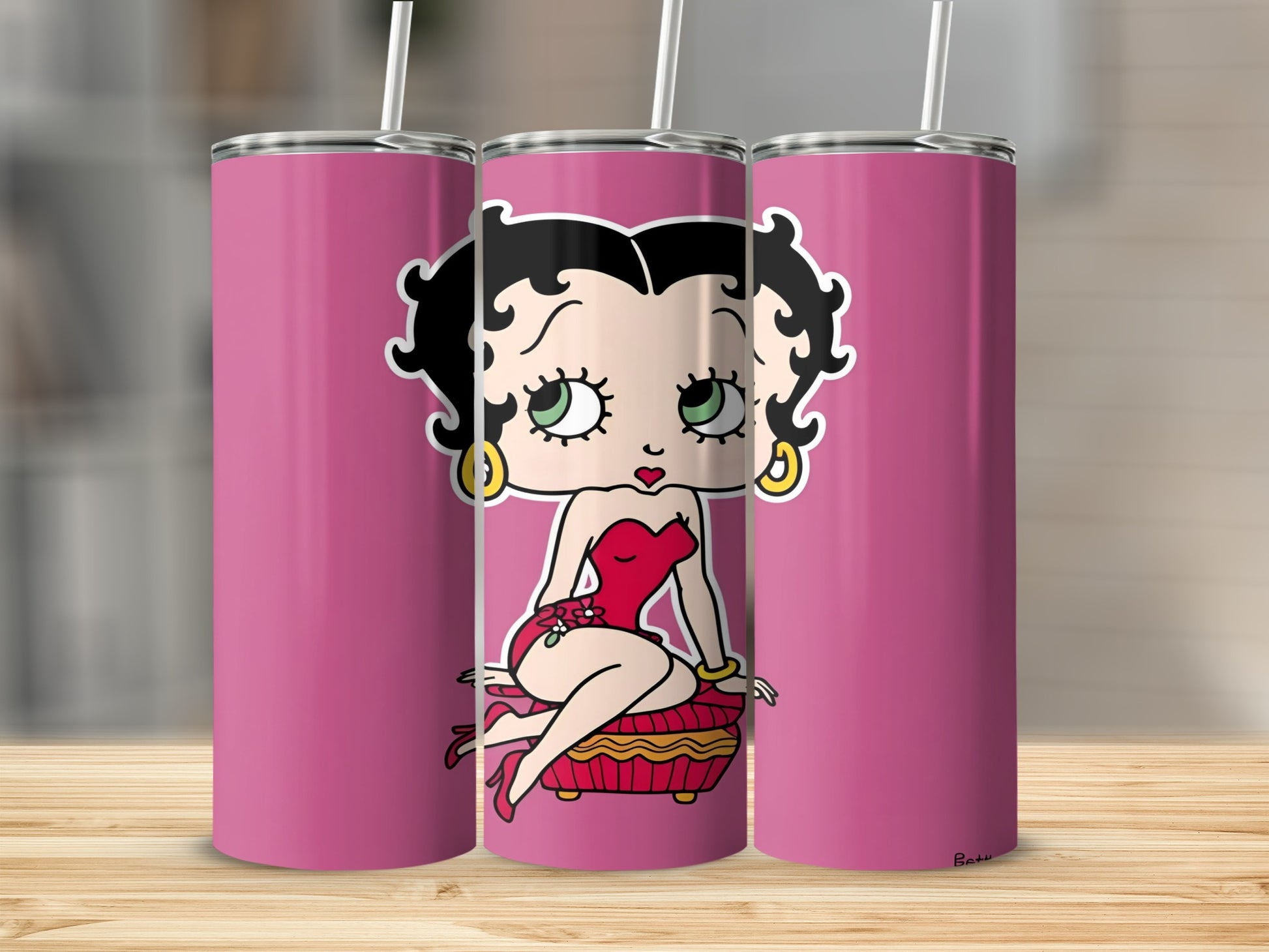 Betty Boop on pink tumbler with straw.