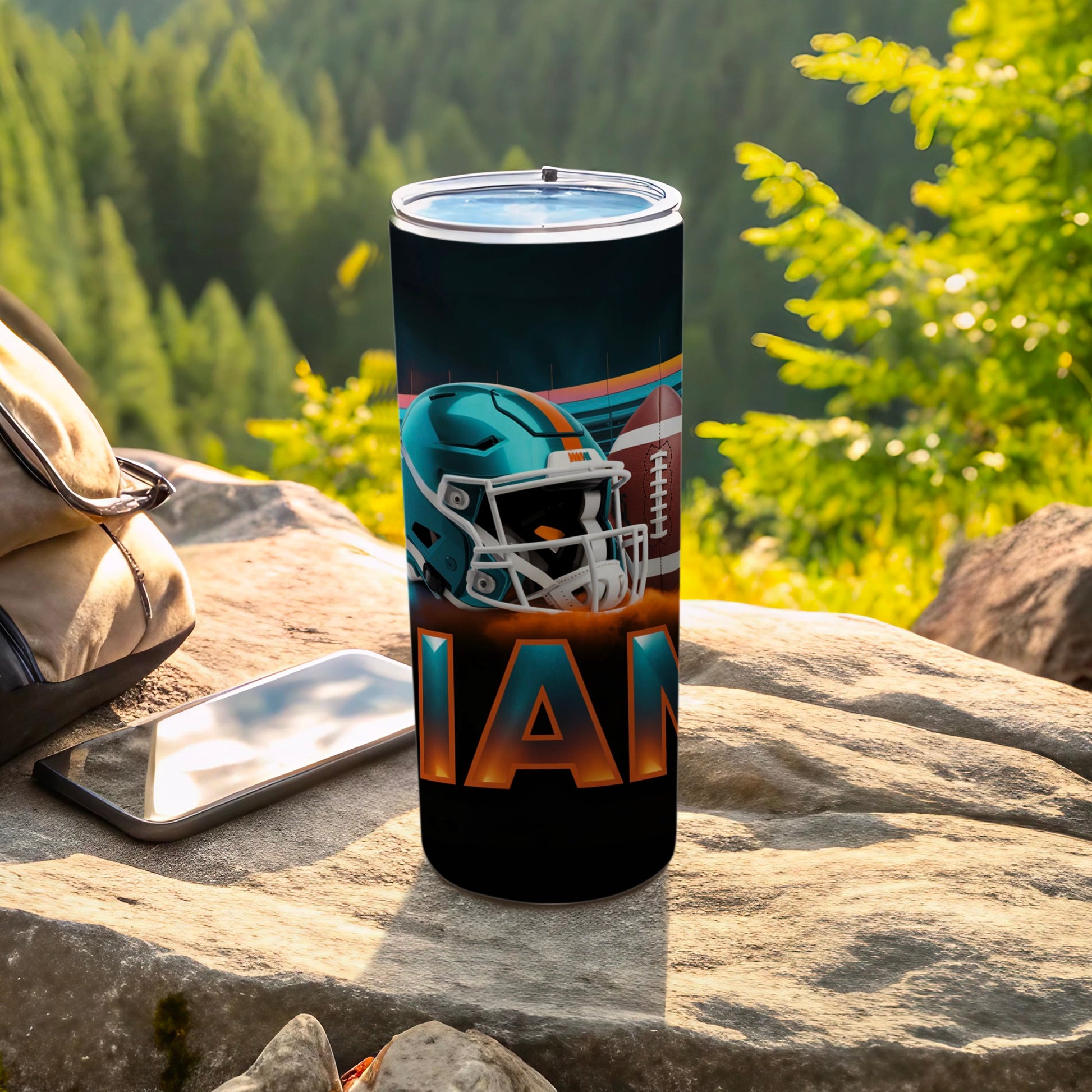 Miami Dolphins football tumbler with helmet and team name.