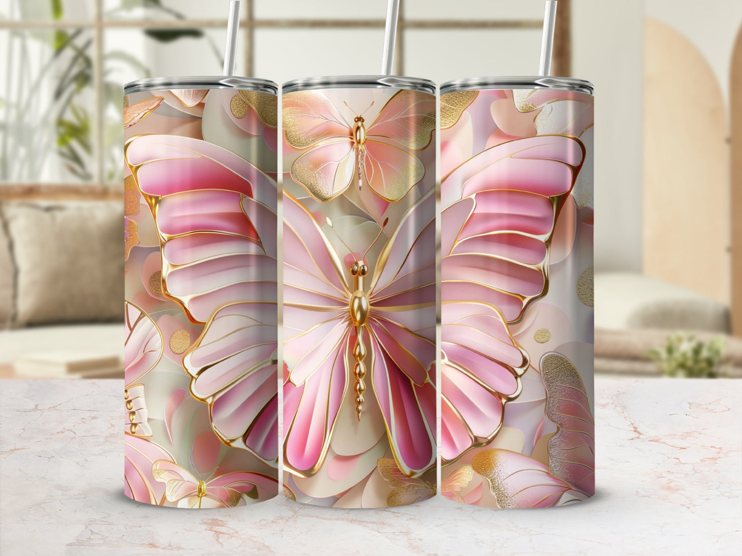 Gold and pink butterfly patterned tumbler with straw.