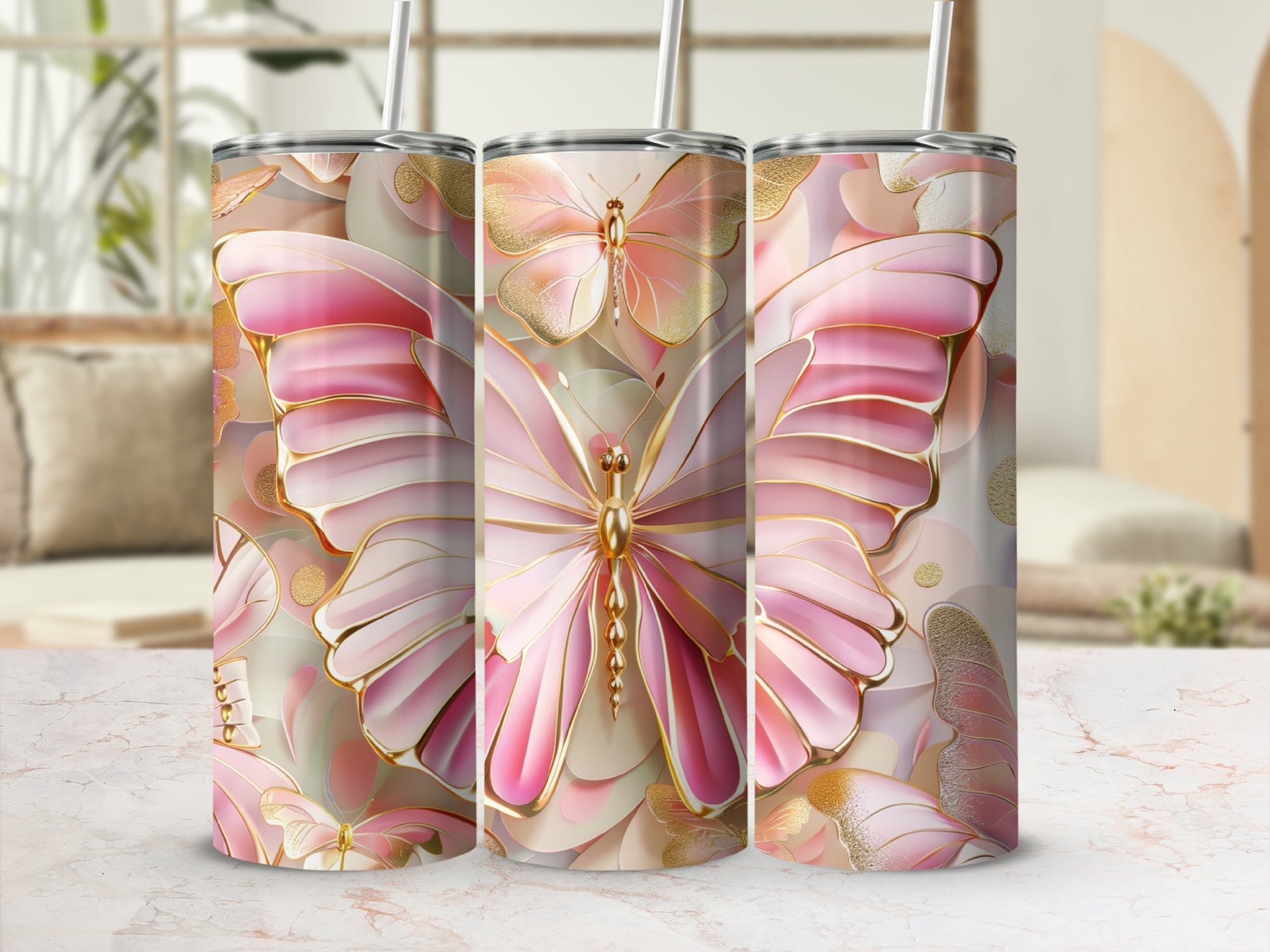 Gold and pink butterfly patterned tumbler with straw.