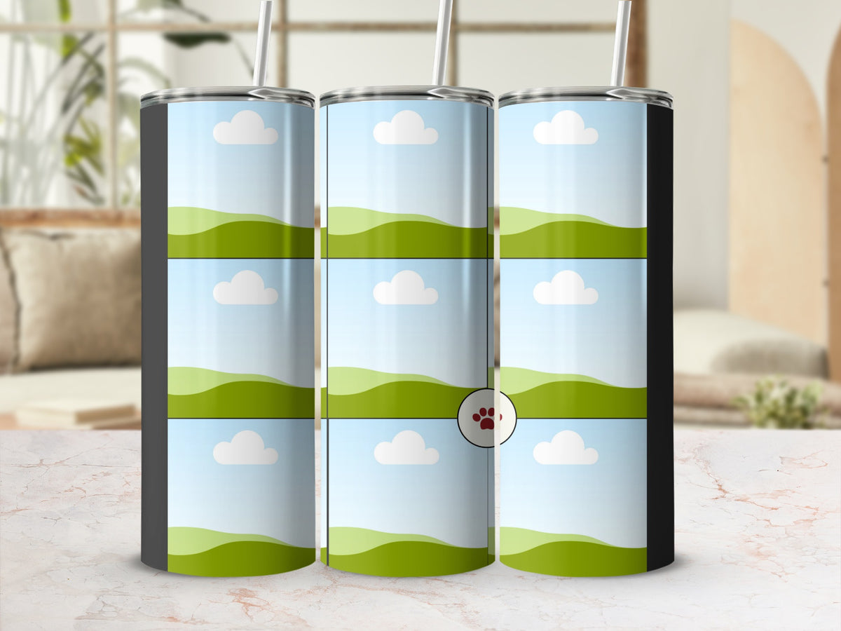 Three tumblers with a blue sky, cloud, and green hill design, one with a paw print.