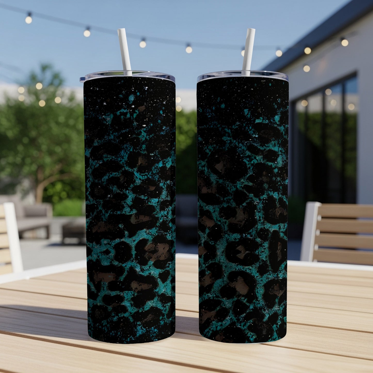 Two tumblers with a teal leopard print and black speckle design.
