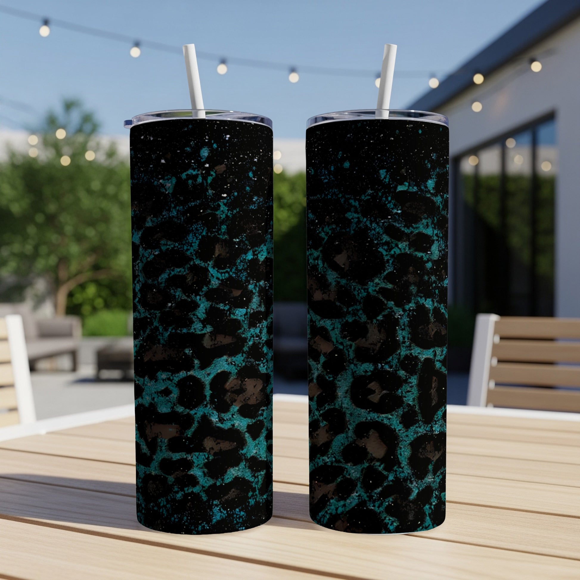 Two tumblers with a teal leopard print and black speckle design.