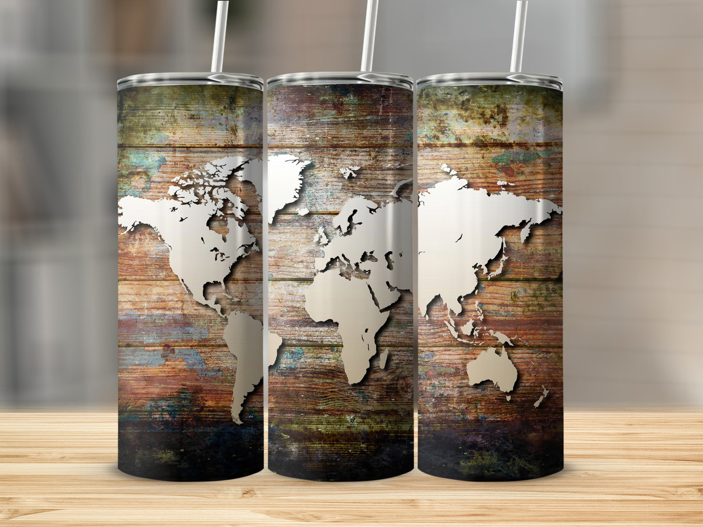 Three tumblers with a rustic wood background and a white world map design.