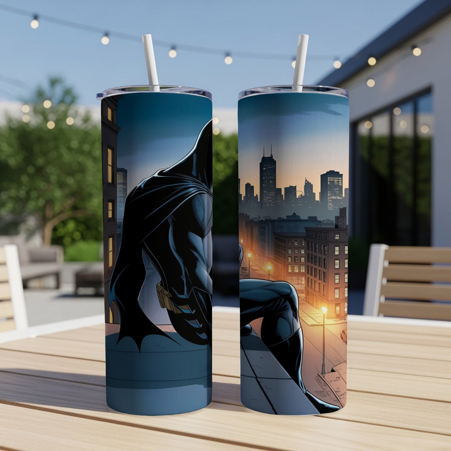 Batman sitting on a rooftop overlooking a city skyline at dusk.