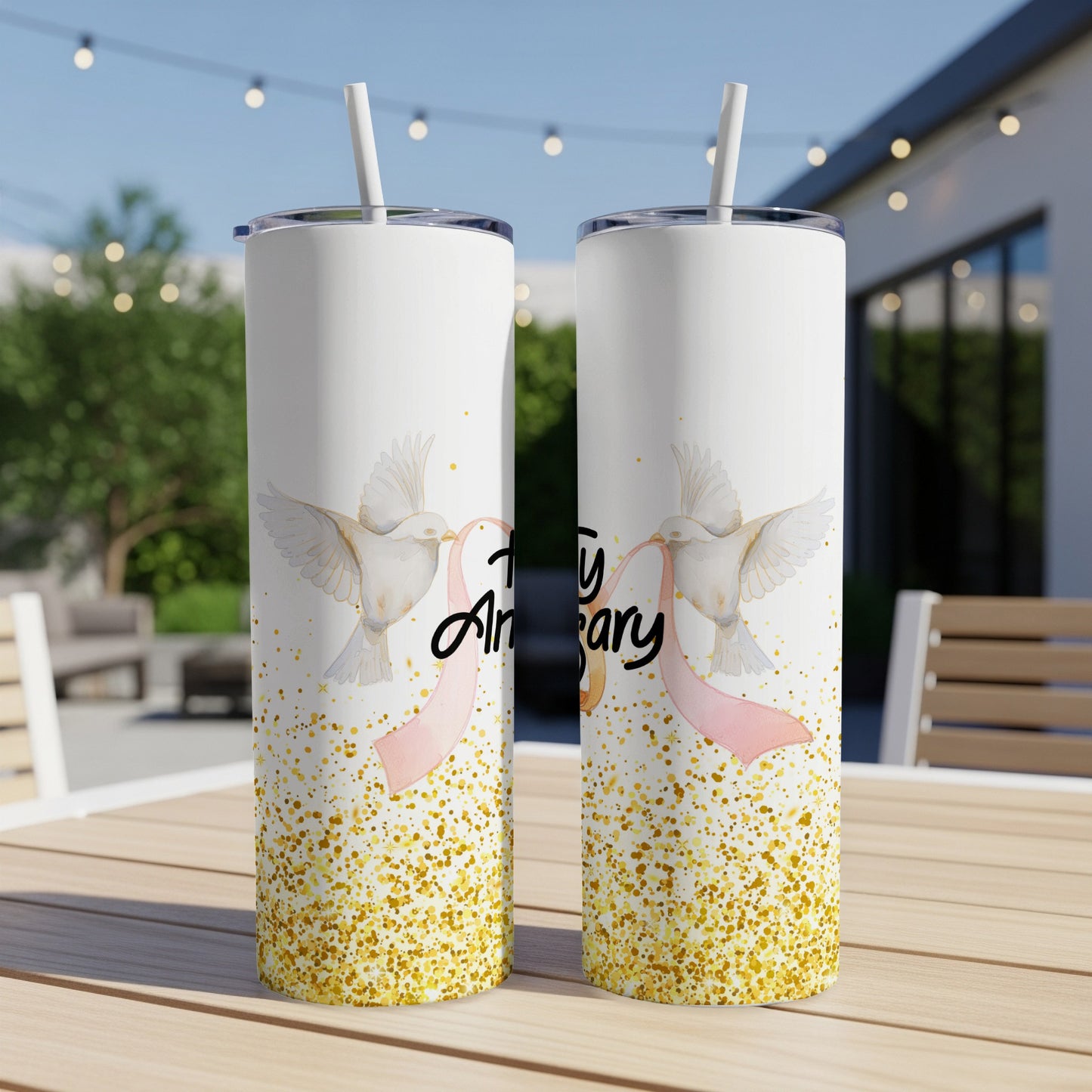 White tumbler with doves and "Anniversary" text surrounded by gold glitter.