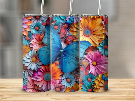 Three tumblers with colorful floral and butterfly designs.