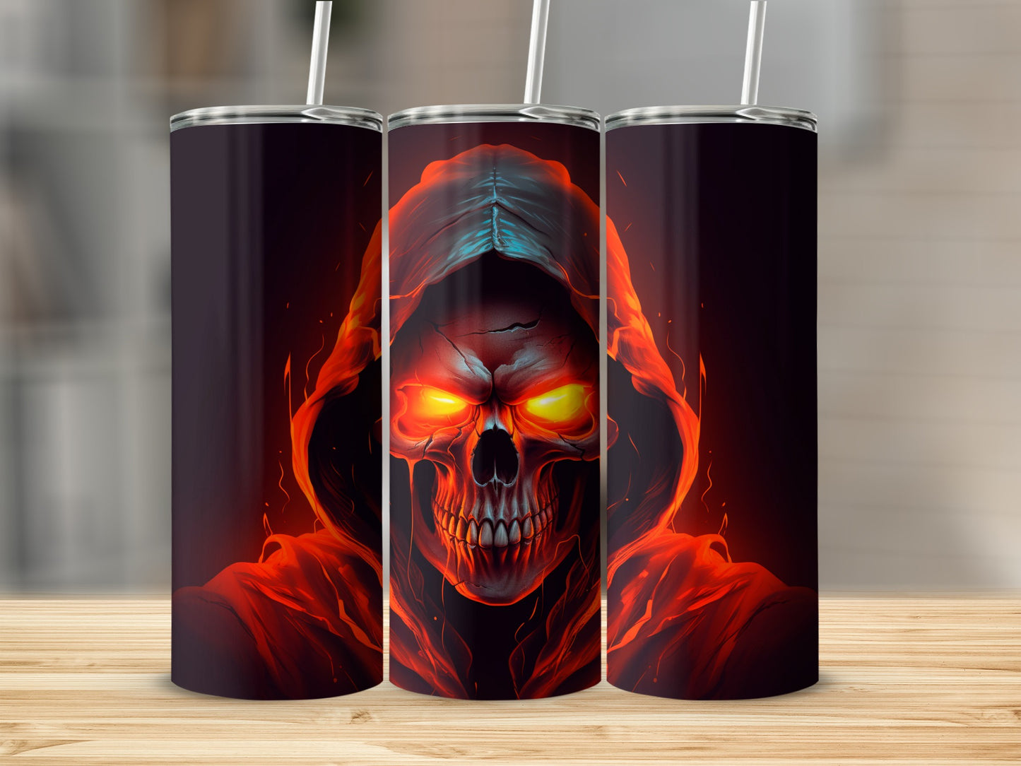 Three tumblers with a flaming skull design, one in the center.