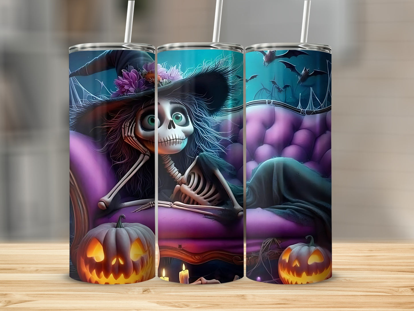 Three Halloween themed tumblers featuring a skeleton witch, pumpkins, and bats.