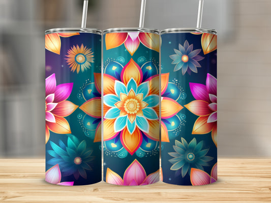 Three tumblers with colorful mandala flower designs on a wooden surface.