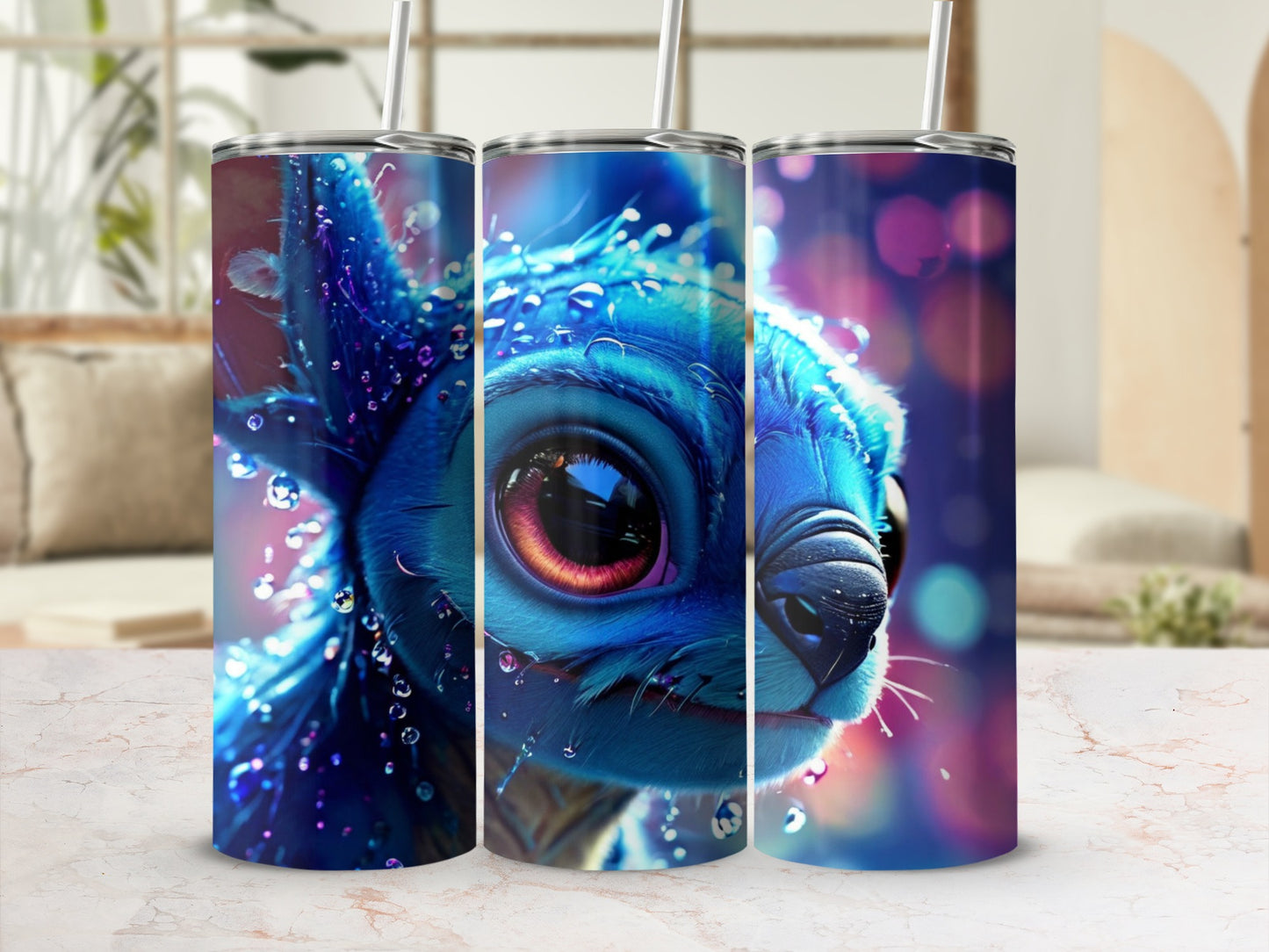 Blue creature with large eyes on a patterned tumbler with straws.