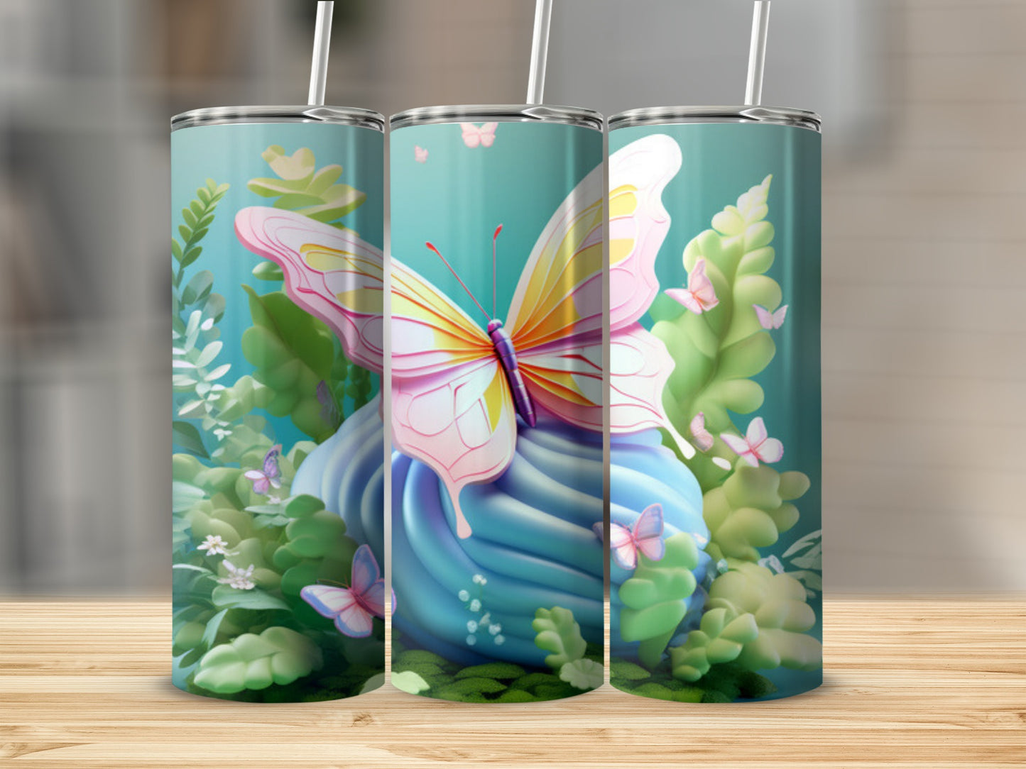 Tall tumbler with a blue frosted cupcake and pink butterfly.