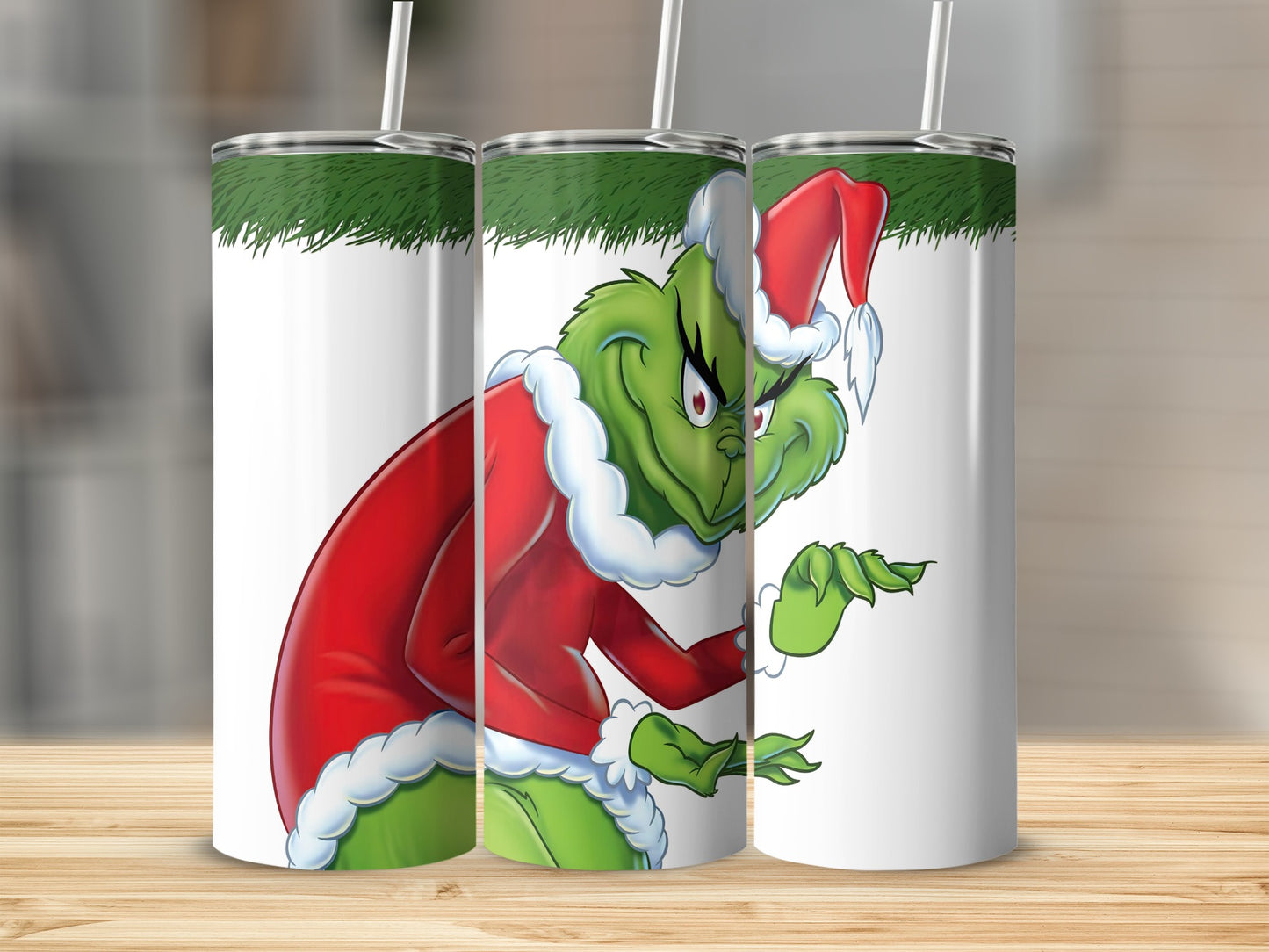 Grinch character in Santa suit on a white tumbler with green top.