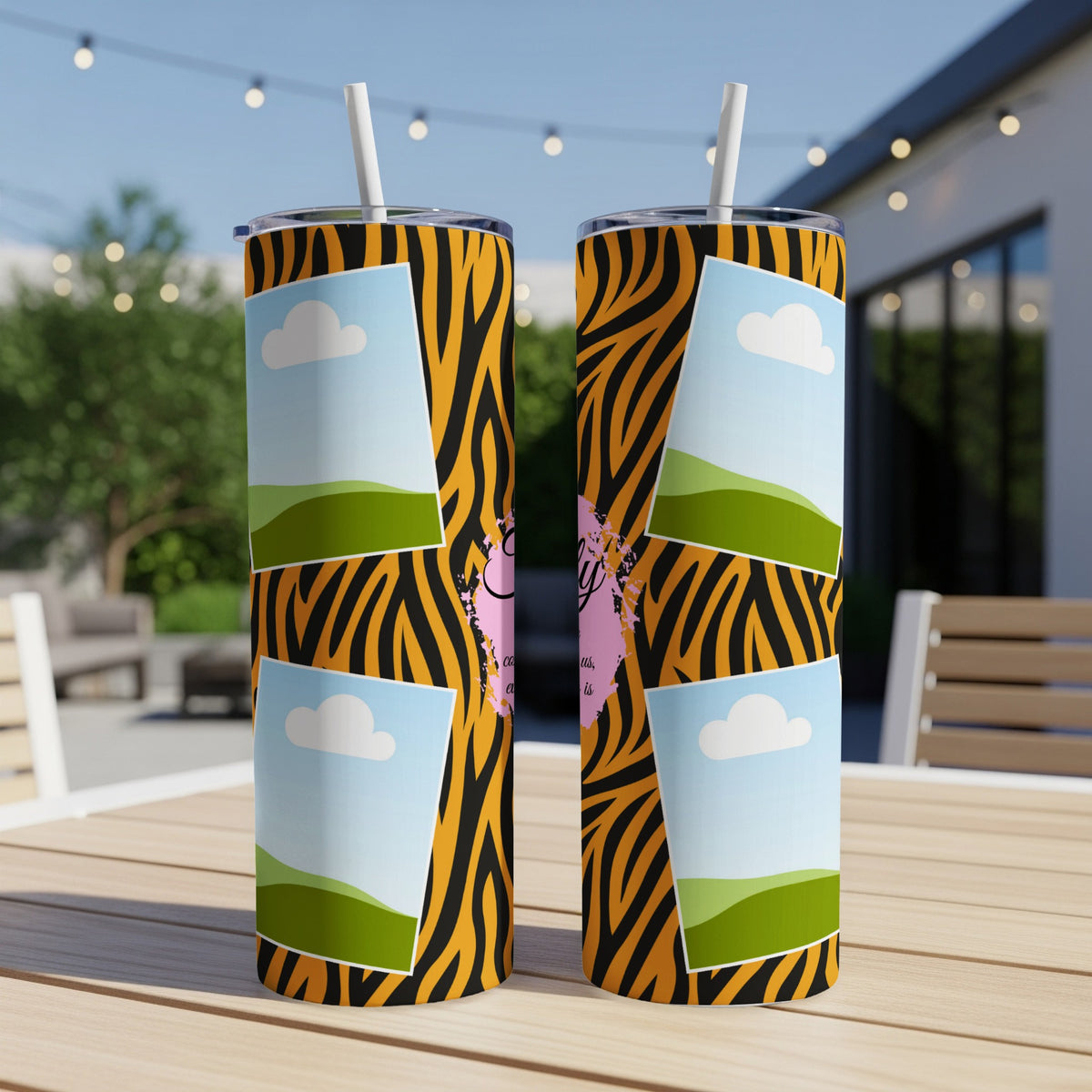 Two tumblers with tiger stripes and picture placeholders on a wooden table.