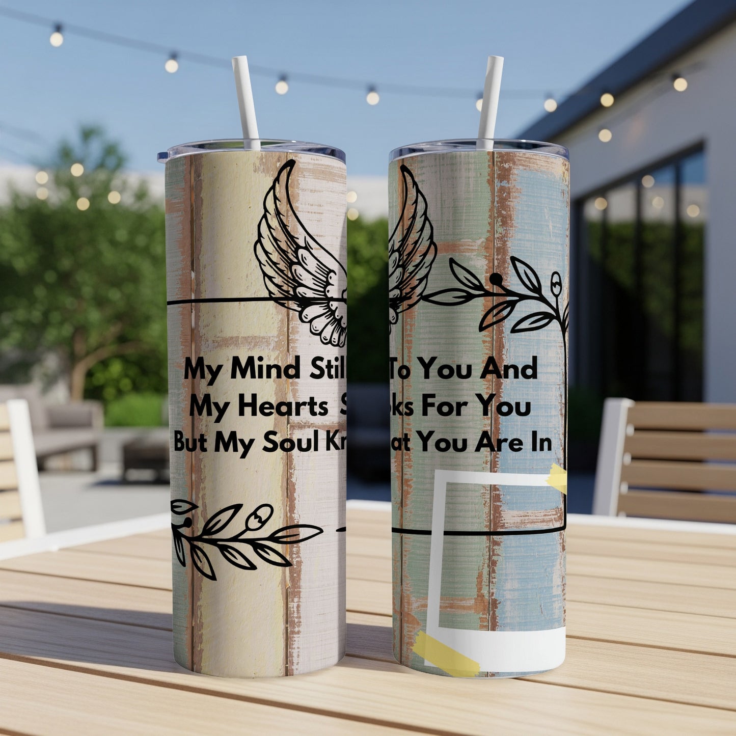 Two tumblers with wood-grain design and black line art of wings and branches.