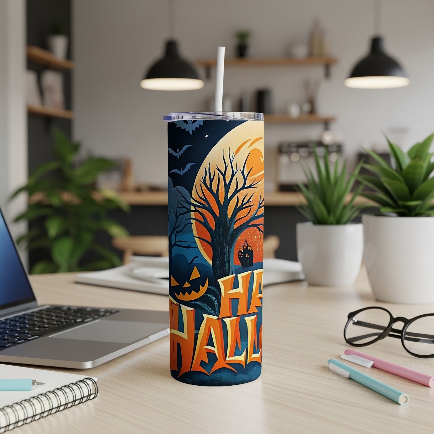Tall tumbler with a Halloween design featuring a Jack-o'-lantern and bats.