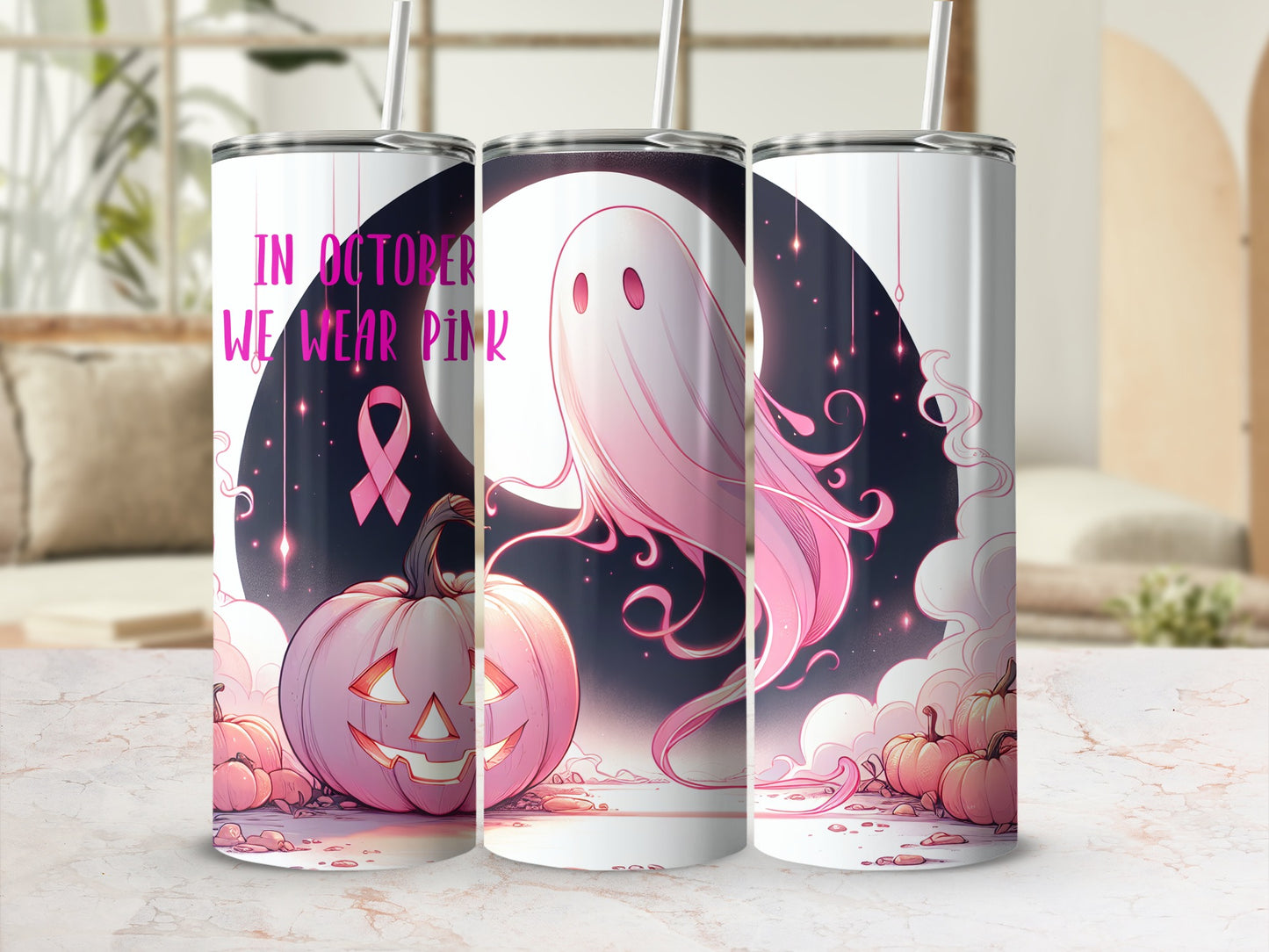 Pink ghost and pumpkin tumbler with breast cancer ribbon, "In October We Wear Pink" text.