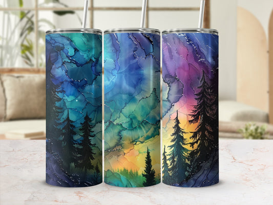 Three tumblers with abstract colorful forest designs and pine trees.