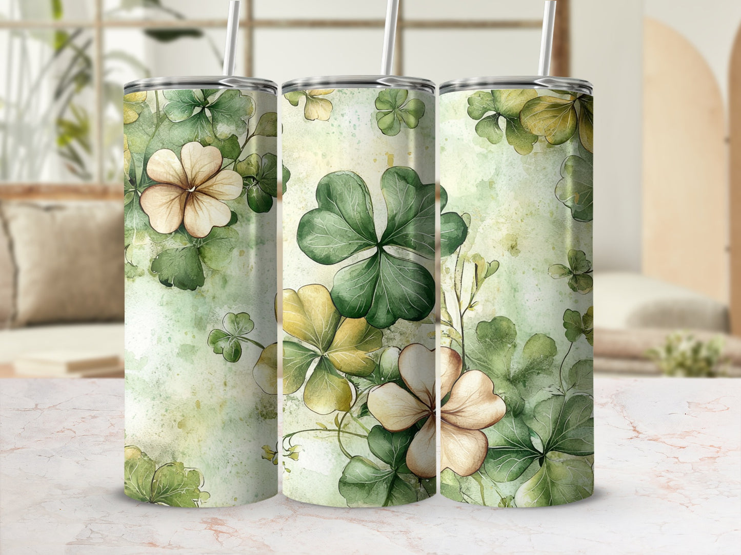 Three tumblers with a watercolor floral and shamrock design.