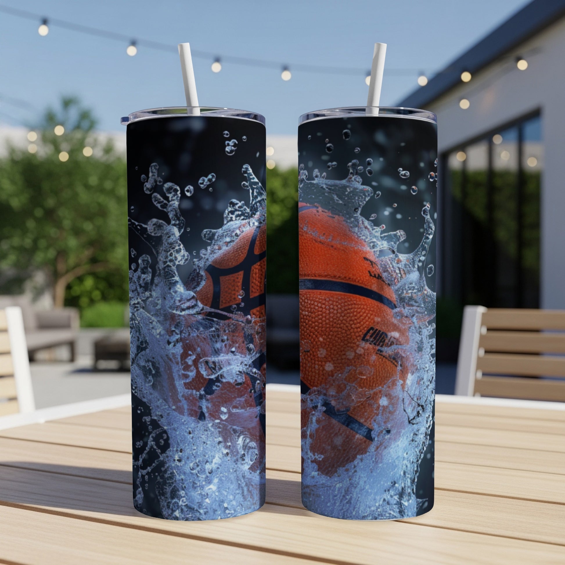 Basketball splashing into water on two tumblers outdoors.