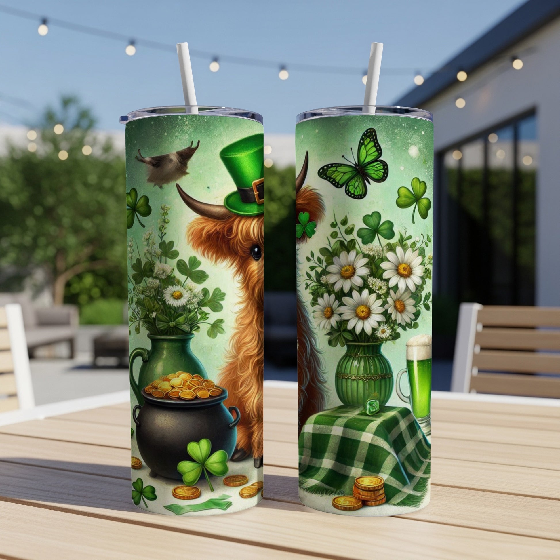 Two St. Patrick's Day themed tumblers with a Highland cow and shamrocks.