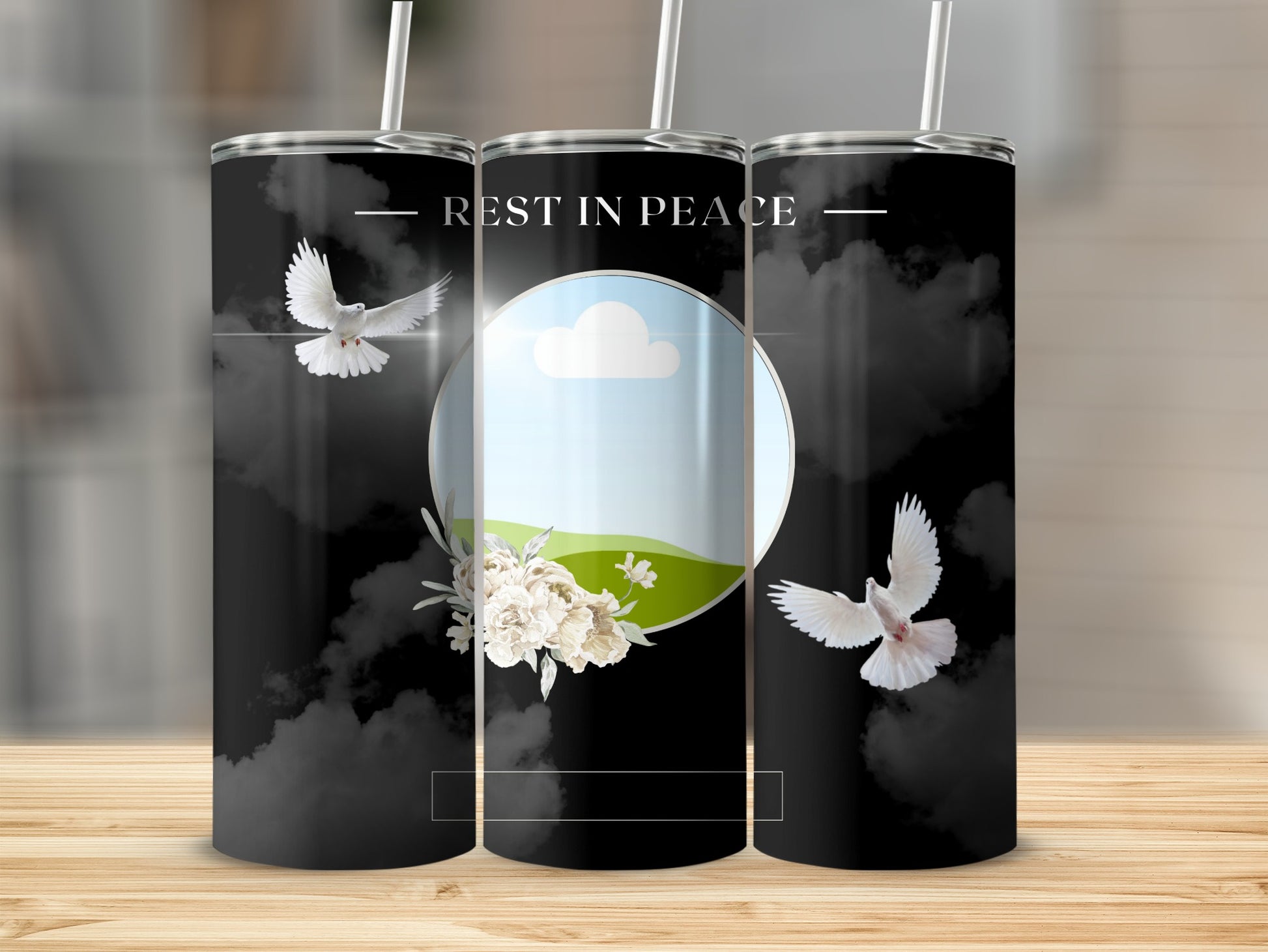 Tumbler with "Rest in Peace" text, doves, flowers, and cloudy sky design.