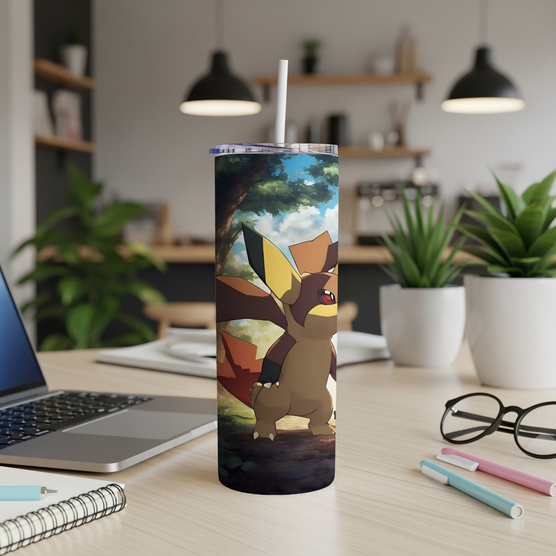 Fennekin Pokémon character on a tumbler with a blurred kitchen background.