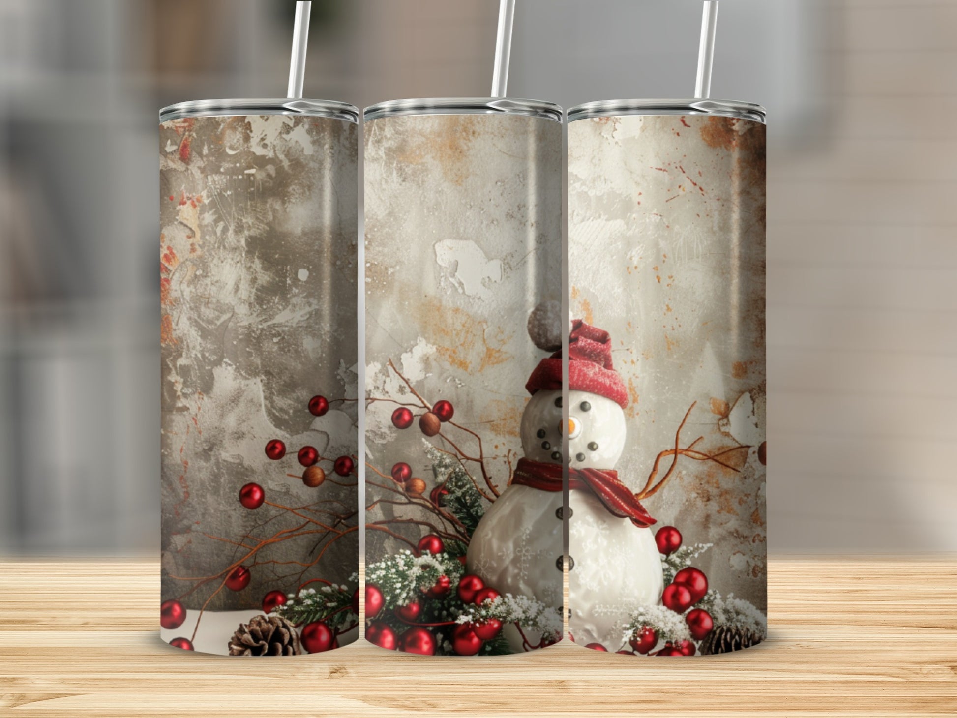 Three tumblers with snowman and berry holiday design.