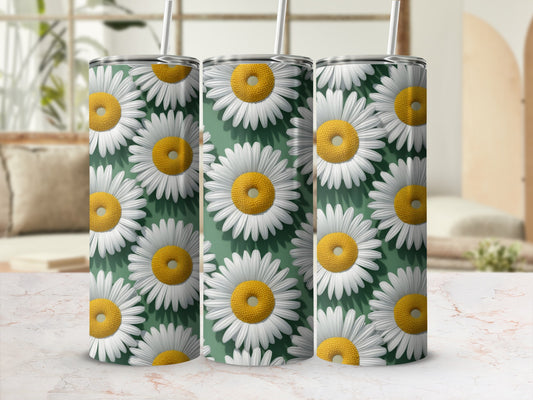 Three tumblers with a repeating daisy pattern on a green background.
