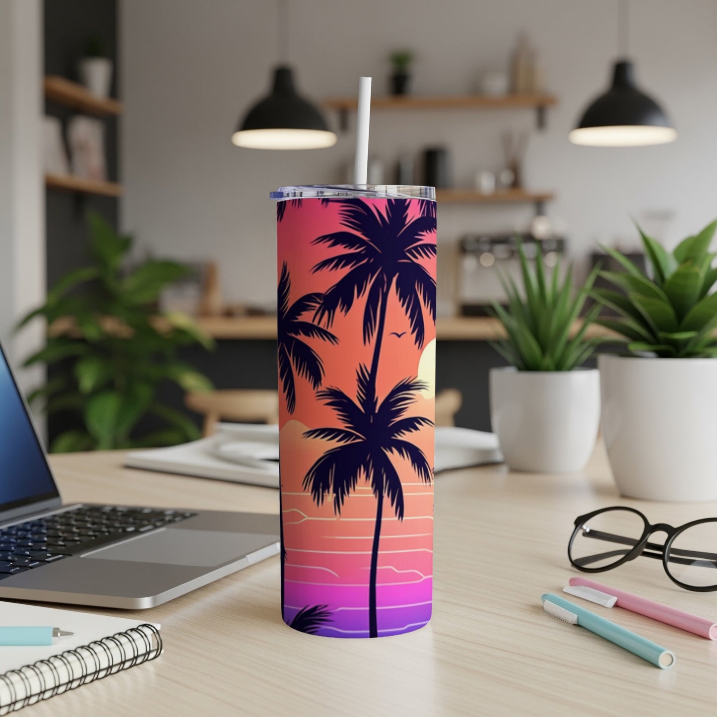 Tall tumbler with a sunset and palm tree design.