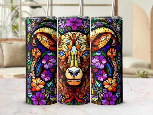 Colorful stained glass ram with floral pattern on three tumblers.