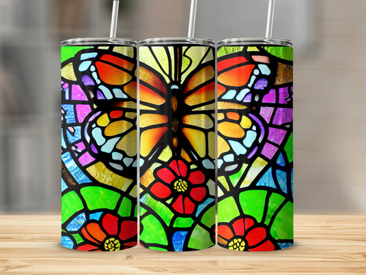 Three tumblers with colorful stained-glass butterfly and flower designs.