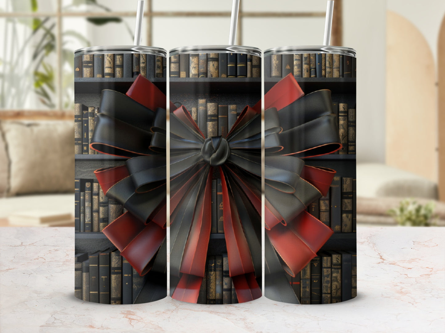 Three tumblers with a black and red bow over a bookshelf background.