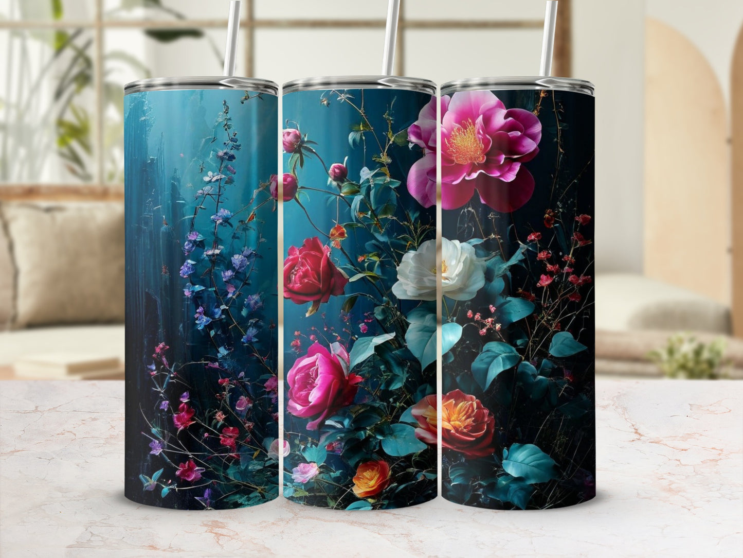 Three tumblers with deep blue backgrounds and vibrant pink and red floral designs.