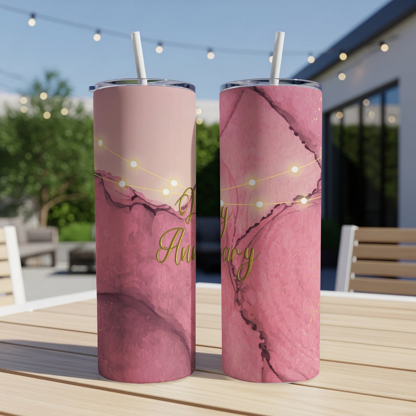 Pink marble tumblers with "Happy Anniversary" text and gold lights.