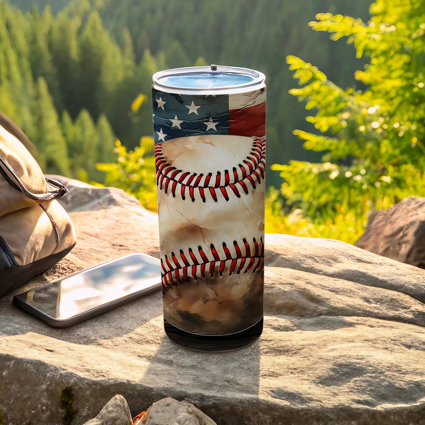 Tumbler with American flag and baseball stitching design on rocks.