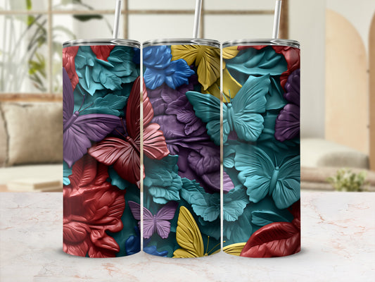 Three tumblers with a vibrant butterfly and floral embossed design.