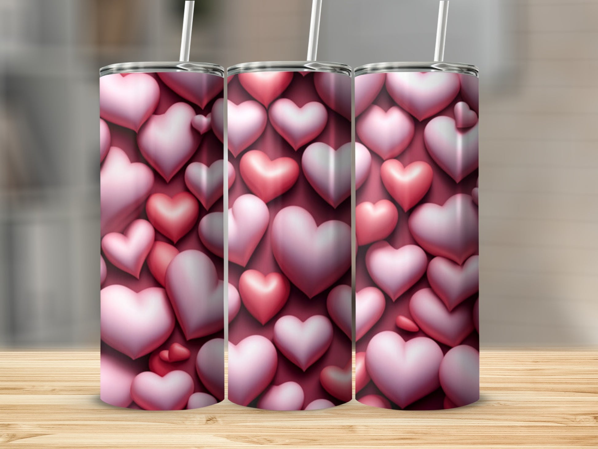 Three pink and red 3D hearts on a tumbler design