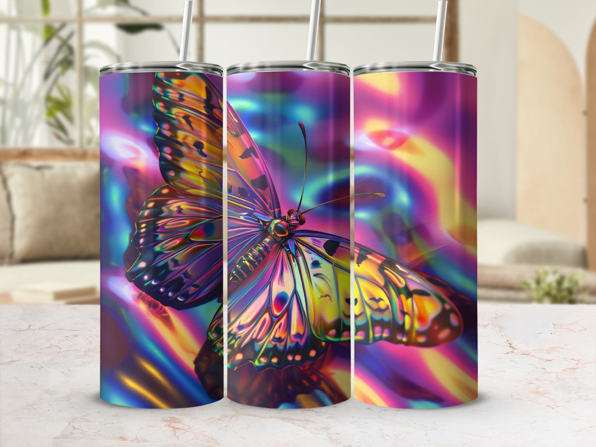 Three tumblers with a psychedelic butterfly design in vibrant colors.