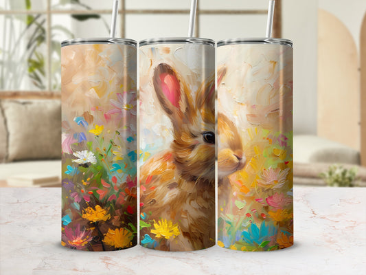 Three tumblers with a painted rabbit and floral design.