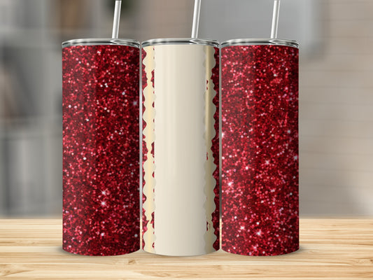 Three tall tumblers, two with red glitter, one with a cream design.