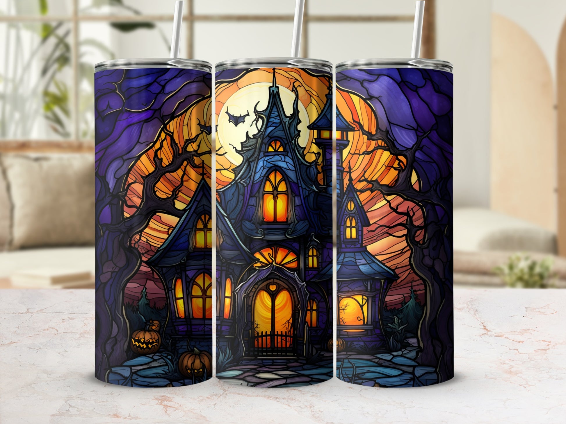 Haunted house with moon, pumpkins, and spooky trees on a tumbler.