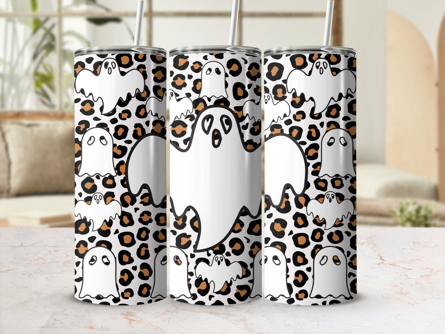 Three tumblers with white ghosts and leopard print pattern.
